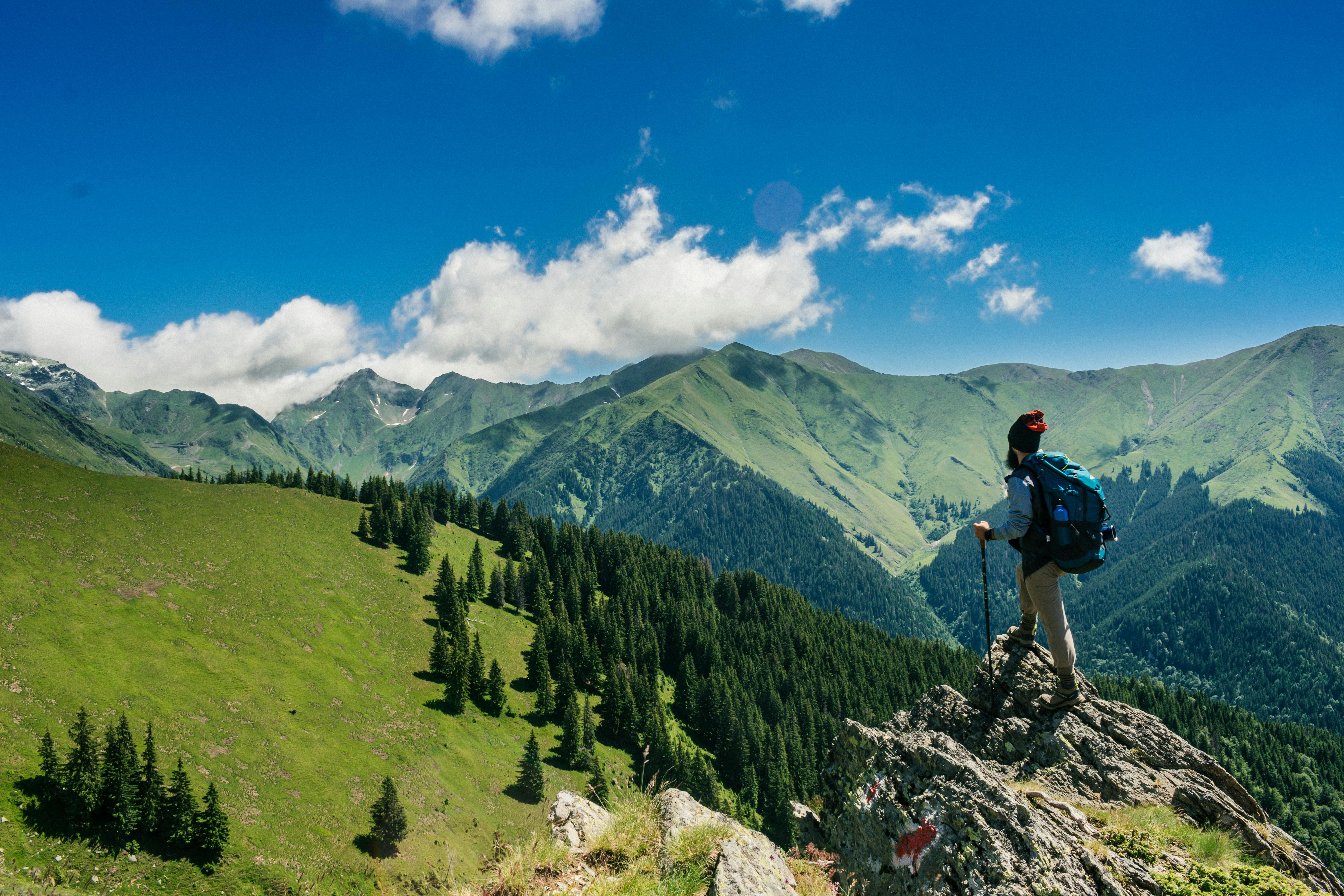 A man hiking overlooking beautiful scenery